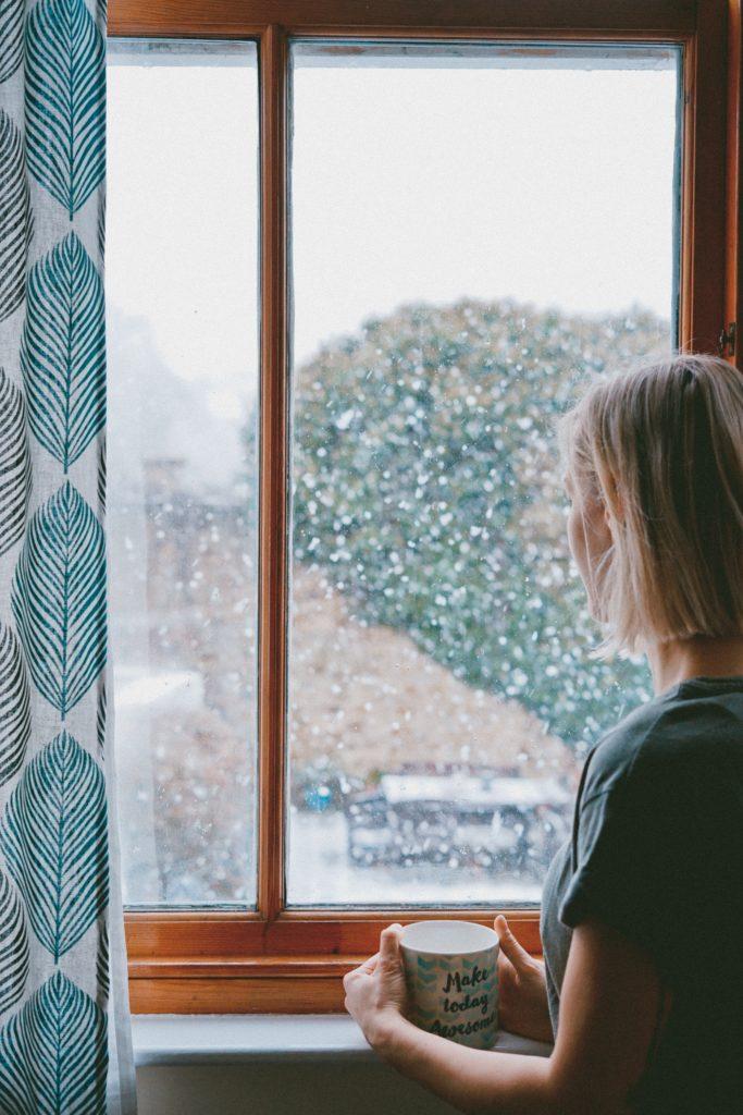 girl alone rainy window