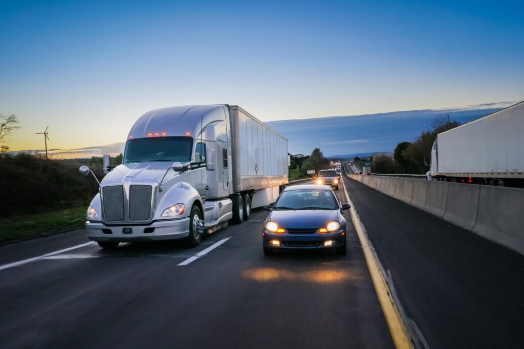 large-truck-on-the-road-beside-a-car