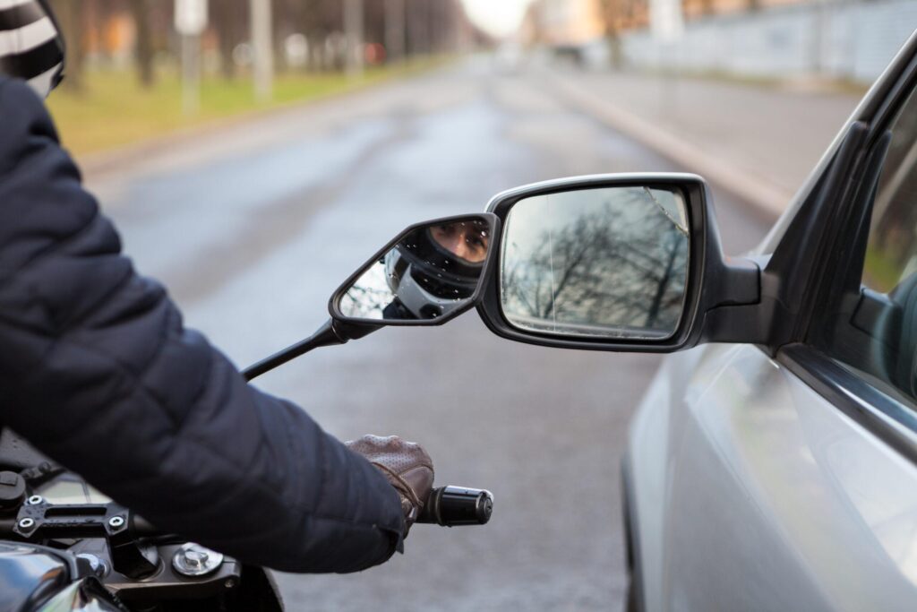 motorcycle-and-car-next-to-each-other-on-the-road